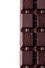 Broken dark chocolate broken stack isolated on white background