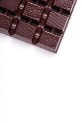 Broken dark chocolate broken stack isolated on white background
