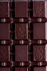 Broken dark chocolate broken stack isolated on white background