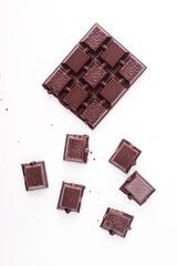 Broken dark chocolate broken stack isolated on white background