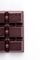 Broken dark chocolate broken stack isolated on white background