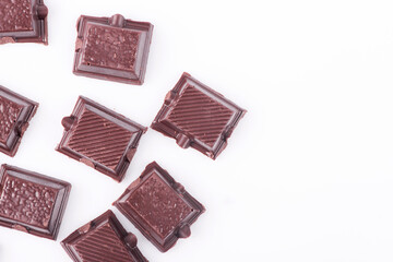 Broken dark chocolate broken stack isolated on white background