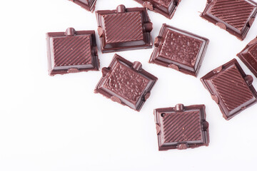 Broken dark chocolate broken stack isolated on white background