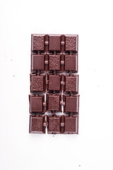 Broken dark chocolate broken stack isolated on white background