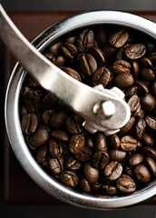 coffee beans in a coffee grinder