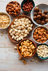 Bowls with various  nuts on a table