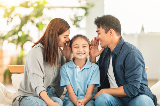 Happy Family And Child Whispering Gossip