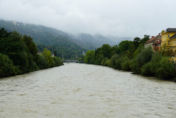 Fototapeta premium View of the Inn river on a foggy day in Innsbruck, Austria