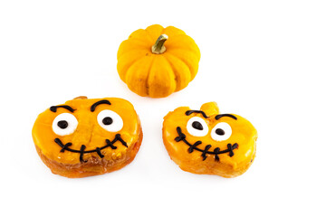pair of donuts halloween symbol jack lantern and orange pumpkin set festive on isolated background
