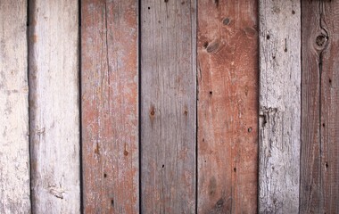 vintage background texture made of wooden boards. The panels have partially lost their paint.