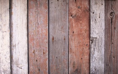 Naklejka premium vintage background texture made of wooden boards. The panels have partially lost their paint.