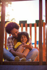  Mother and daughter on playground.