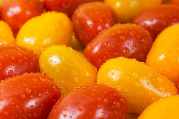 red and yellow tomatoes with drops of water. Pattern