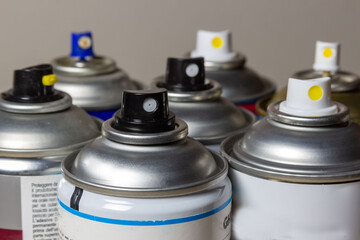 spray cans for paint or lamination to protect photographs or paintings