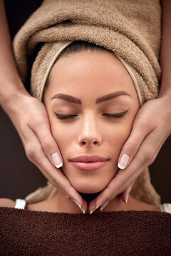 woman receiving facial massage