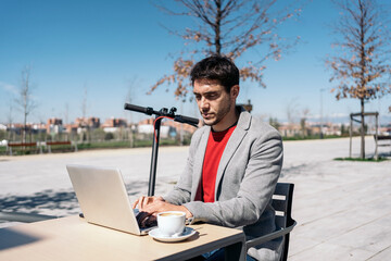 Young Entrepreneur Working On The computer outdoors