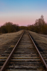 Fototapeta na wymiar abandoned railway in the evening