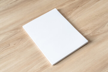 Book cover mockup with blank white front paper page a4 paperback mock up for catalog, magazine, menu, booklet, notebook, portfolio design template on wood table background