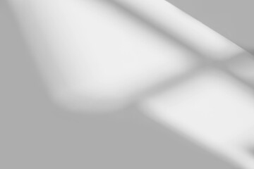 Abstract light reflection and grey shadow from window on white wall background , dark gray and sunshine diagonal geometric effect overlay for backdrop and mockup design