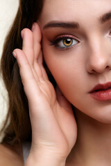 Fototapeta premium Beauty portrait of young woman. Brunette girl with evening female makeup.