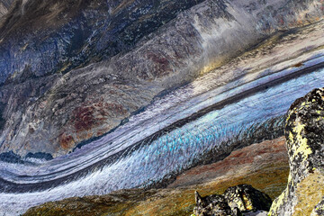 A melting glacier stream in the mountains due to climate change