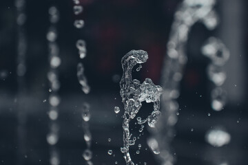 Water droplets flying from a water fountain. splashing water - Beautiful water wallpapers