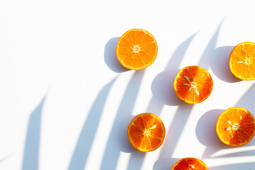 High vitamin C, Juicy and sweet. Fresh orange fruit on white background with leaf shadowit