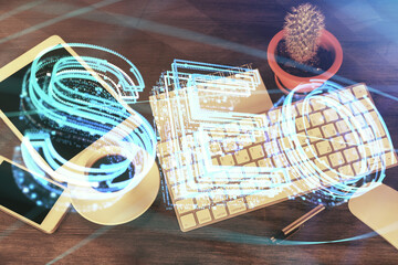 Double exposure of SEO hologram drawing over desktop. Top view. Search optimization concept.
