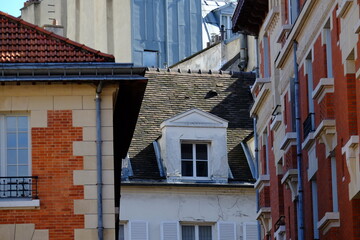 The facade of the Marais an historical quarter in Paris center. Spring 2021, Paris, France.