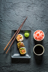 Closeup of sushi with salmon and avocado. Japanese cuisine.