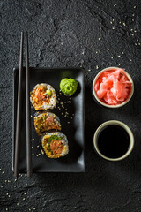 Sushi with salmon and avocado. Traditional Japanese cuisine.