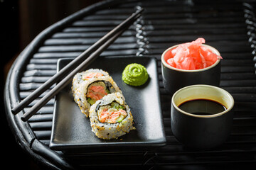 California Maki sushi with avocado and salmon. Japanese cuisine.
