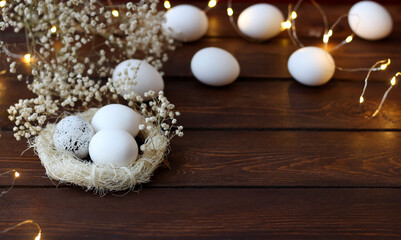Easter photo with eggs in the nest. Preparation for the Easter holiday.