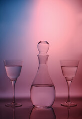 Still life with glass objects on a multicolored background. For interior printing. For the poster