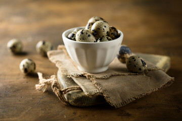 Healthy organic quail eggs in a white bowl
