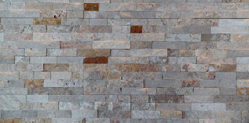 Black stone brick wall background, marbled textured.