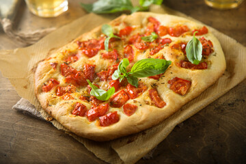 Delicious homemade focaccia with tomatoes and garlic