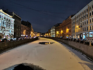 Fototapeta na wymiar Saint Petersburg, Russia - January 6, 2021: Night view of the Moika River and its picturesque embankments