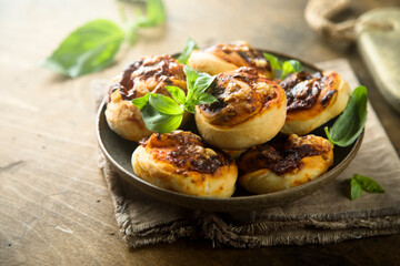Homemade cheese swirls with pesto sauce