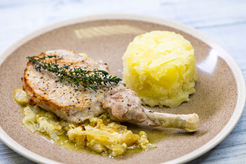 pork chop with thyme baked on creamy onion with mashed potatoes