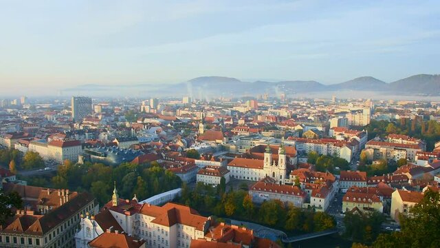 Cityscape of Graz from Schlossberg hill with historic and modern buildings, in Styria region, Austria, in the morning