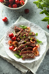 Beef steak with cherry salsa