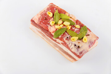 Striped pork belly with garlic isolated on white background.