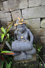 Balinese playing traditional music instrument statue 