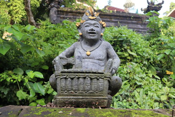 Balinese playing traditional music instrument statue 