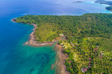 Green forest island sea with turquoise water