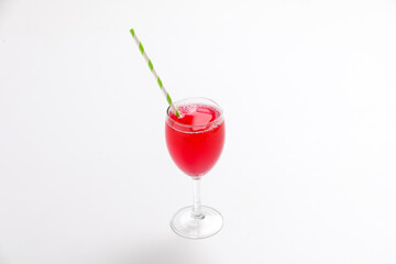 red juice or berry compote with splashes in glass isolated on white background