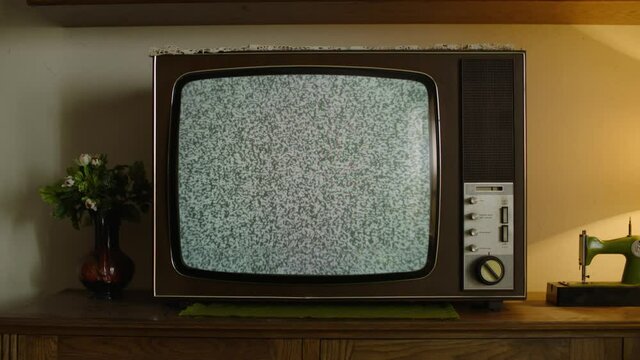Old Retro television with white noise on the screen.