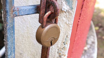 Vintage old retro lock on a gate.