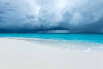 tropical Maldives island with white sandy beach and sea